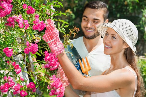 Close-up of trimmed hedge edge and professional tools at a Canary Wharf property